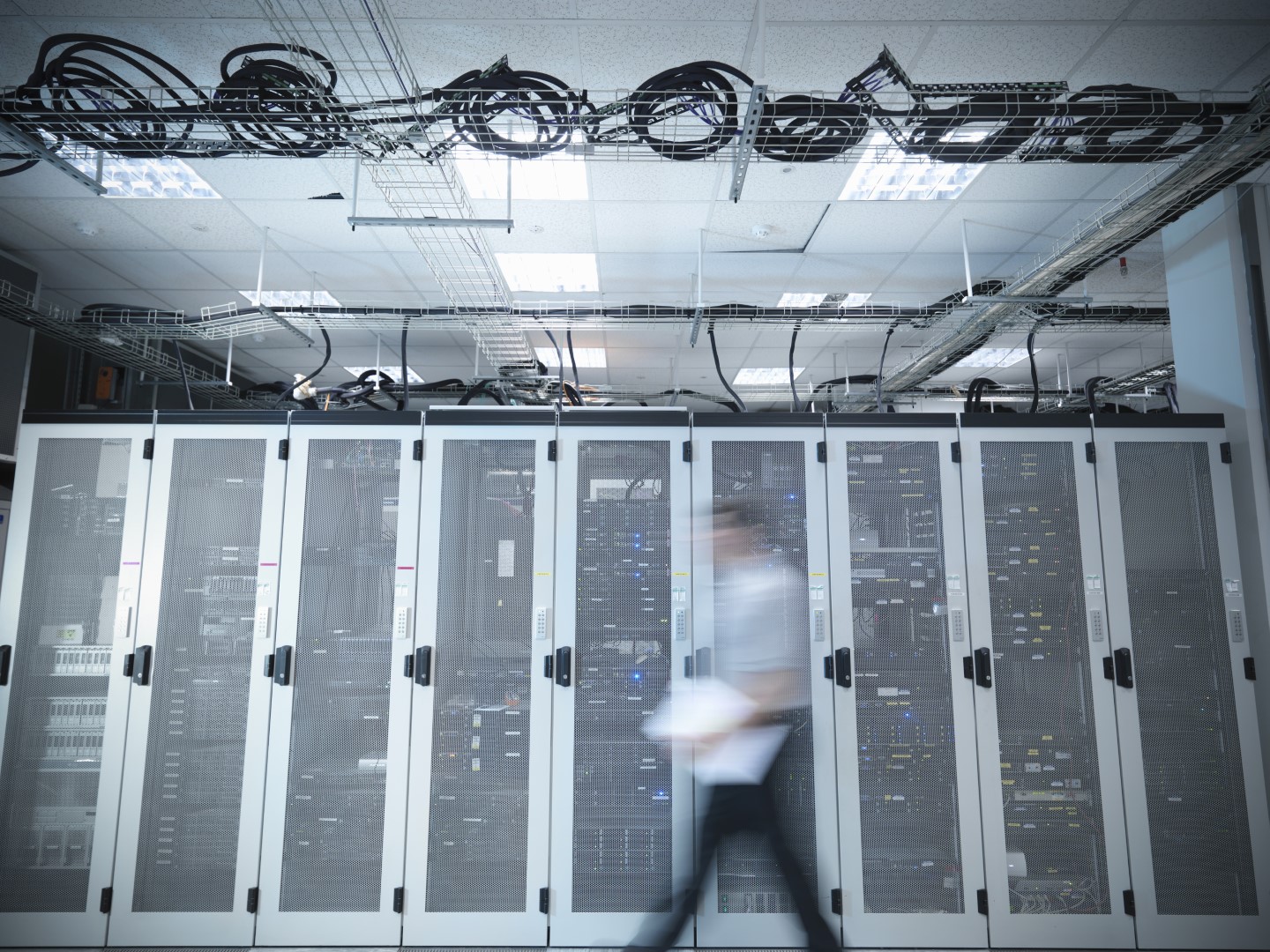 Man walking through server room.jpg