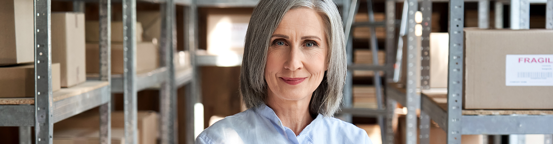 confident-older-woman-manager-standing-in-delivery-2021-09-02-07-23-11-utc.jpg